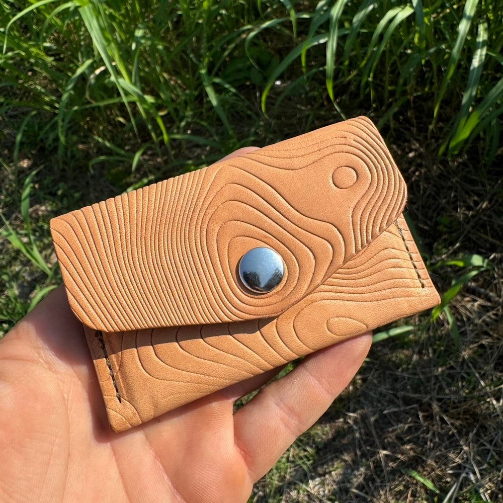 Handmade veg tan leather wallet with embossed topographic print